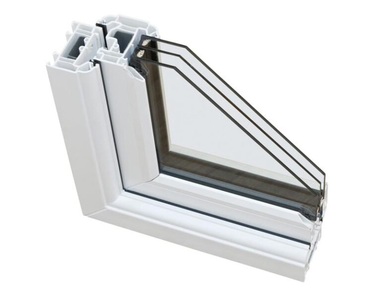 Close-up cross-section of a white triple-pane window frame, showing three layers of insulated glass and vinyl construction.