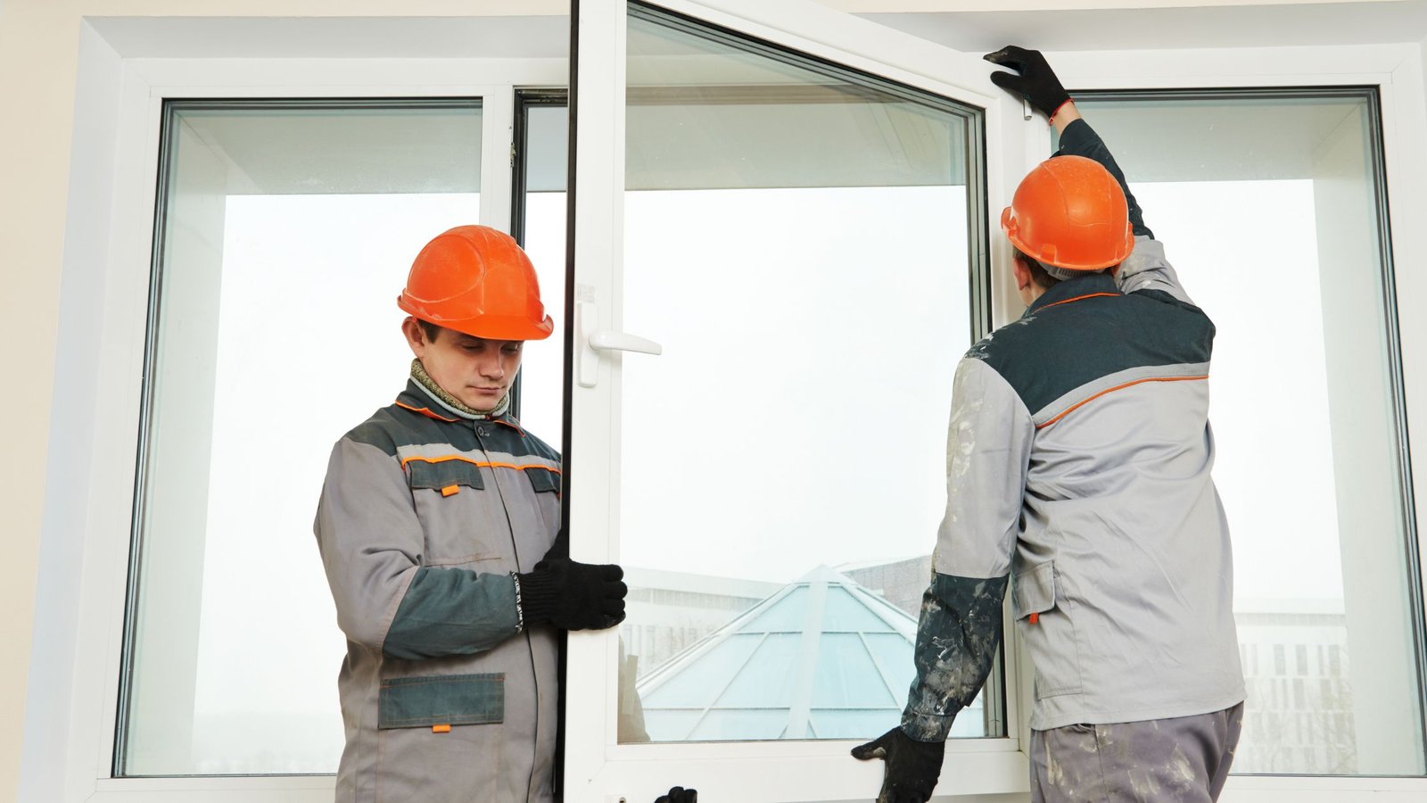 Technicians fixing window replacement mistakes in Vaughan home, installing new energy-efficient window frame to prevent drafts and leaks.